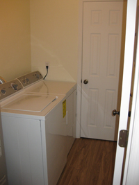 laundry room inside the condo unit