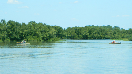 Kayakers near the fishing pier at the end of the nature trail